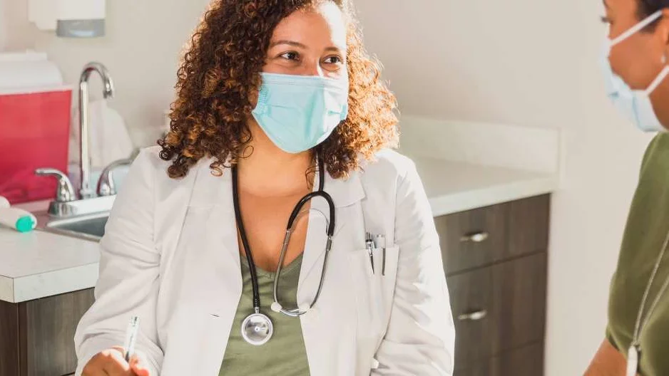 Dr and Patient interacting in a physician's room