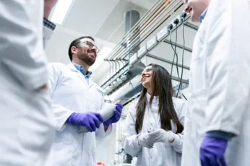 Lab members discussing science inside of lab