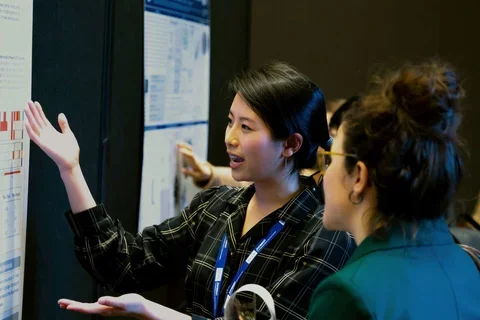 young-female-researcher-poster-session-retreat