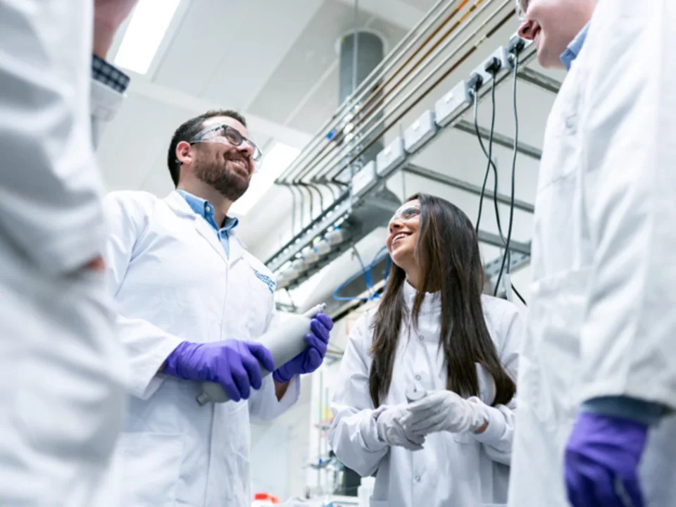Lab members discussing science inside of lab