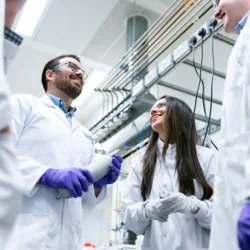 Lab members discussing science inside of lab