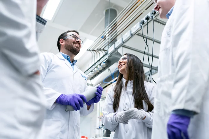 Lab members discussing science inside of lab